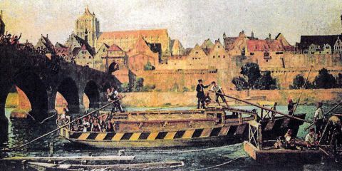 Das Gemälde von Michael Zeno Diemer (1867-1939) zeigt die Abfahrt der hölzernen Zillen, der „Ulmer Schachteln“. Es befindet sich in Privatbesitz. Unten sind die Holzboote auf einer Aufnahme aus dem Jahr 2009 zu sehen.